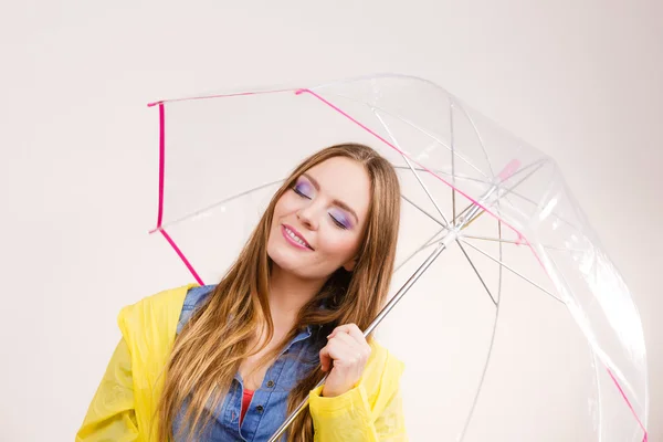 Woman wearing waterproof coat under umbrella — Stock Photo, Image