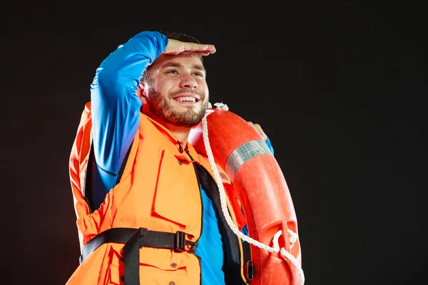 Lifeguard in life vest with ring buoy lifebuoy. — Stock Photo, Image