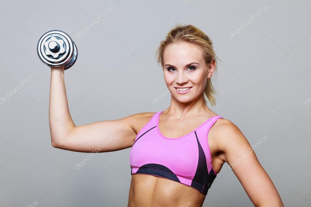 Fit woman lifting dumbbells weights — Stock Photo © Voyagerix 122156818