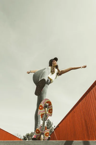 Teen girl skater riding skateboard on street. — Stock Photo, Image