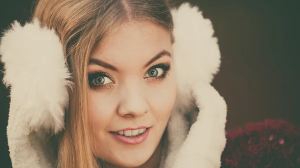 Portrait of pretty gorgeous woman in earmuffs. — Stock Photo, Image