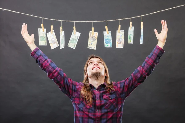 Rich man with laundry of money — Stock Photo, Image