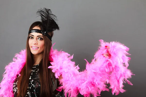 Girl pink plume and black feather on head. Carnival. — Stock Photo, Image