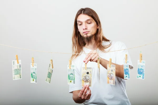 Rijke man met Wasserij van geld — Stockfoto