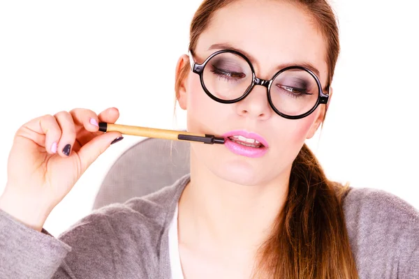 Woman thinking holds pen — Stock Photo, Image