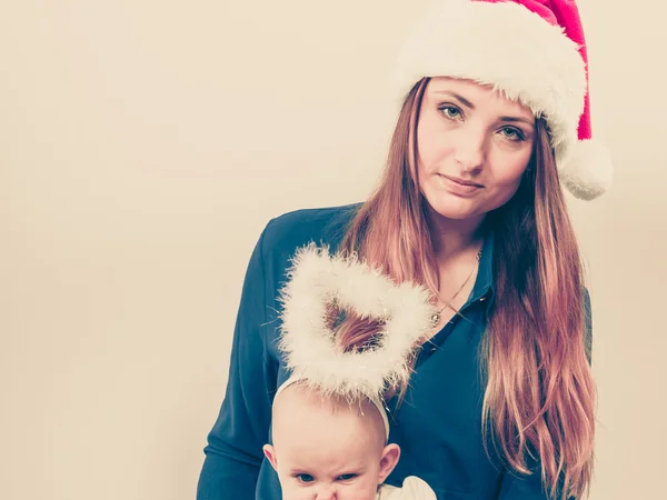 Christmas woman with cute baby. — Stock Photo, Image