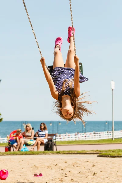 Playful crazy girl on swing. — Stock Photo, Image