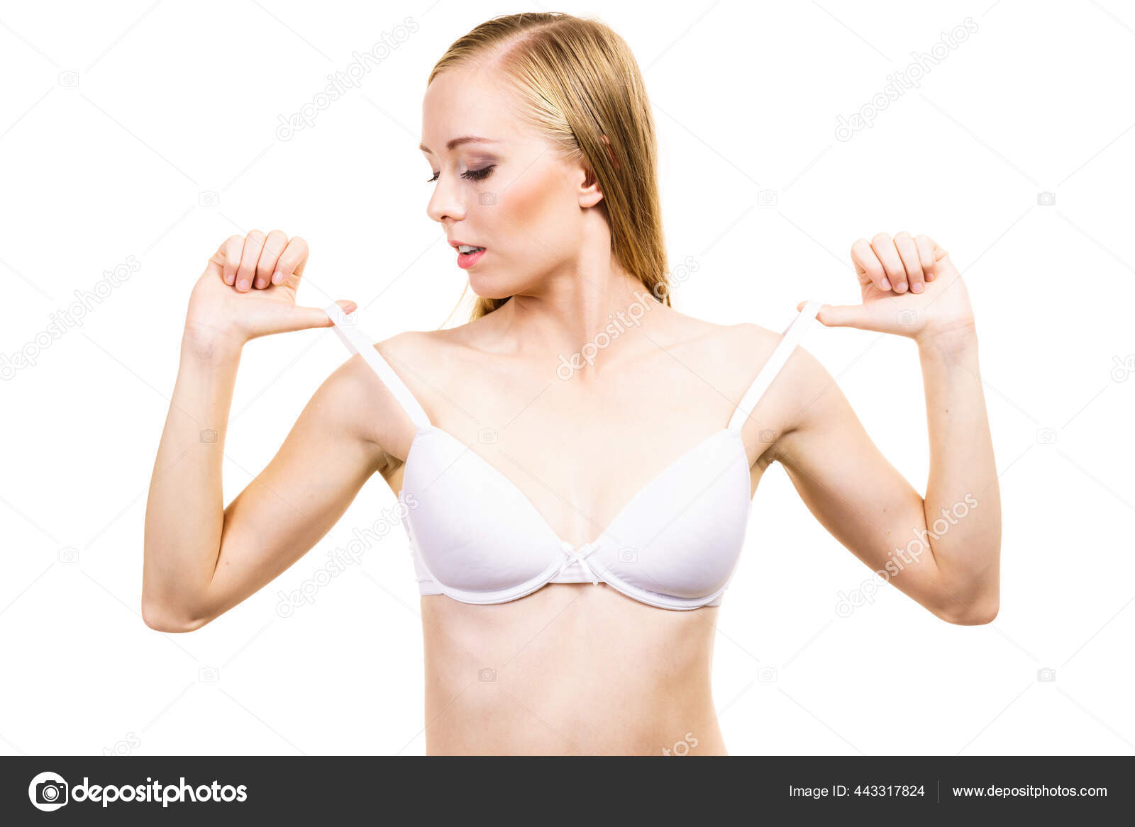 Young Slim Woman Holding Bra Strap. Straps Keep Falling Down