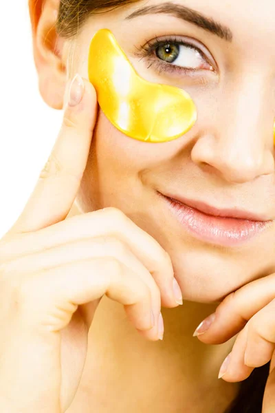 Young Woman Applying Golden Collagen Patches Eyes Mask Removing Wrinkles — Stock Photo, Image