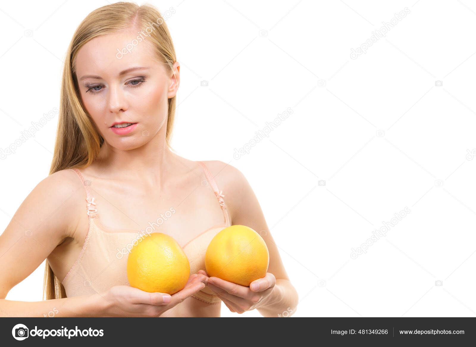 Slim Young Woman Small Boobs Wearing Bra Holding Big Orange Stock Photo by  ©Voyagerix 481349266