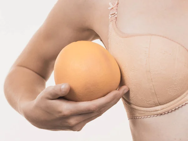 Slim Young Woman Small Boobs Puts Big Orange Fruit Her Stock Photo