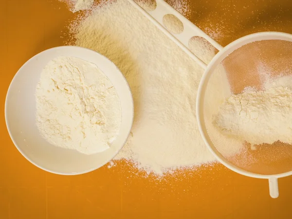 Preparation for baking, ingredients flour sifting. — Stock Photo, Image