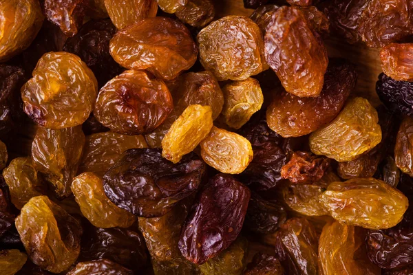 Alimento saludable para la dieta. Pasas de uva seca como textura de fondo —  Fotos de Stock