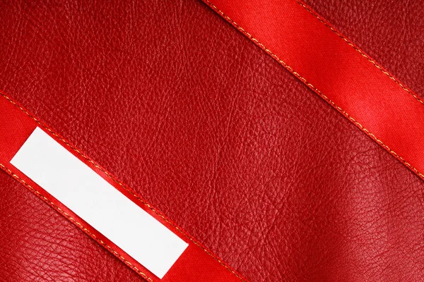 Piece scrap paper blank copy space on red leather background — Stock Photo, Image