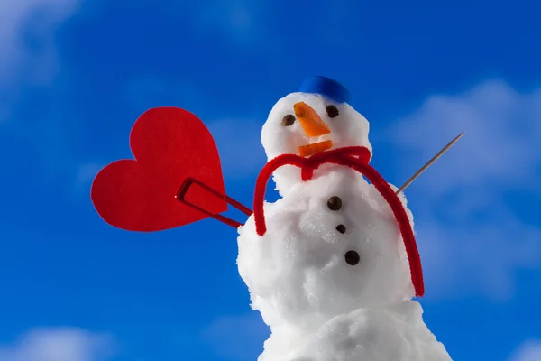 Little happy christmas snowman red heart love symbol outdoor. Winter. — Stock Photo, Image