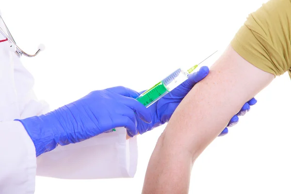 Hands of doctor nurse with syringe giving injection to patient — Stock Photo, Image