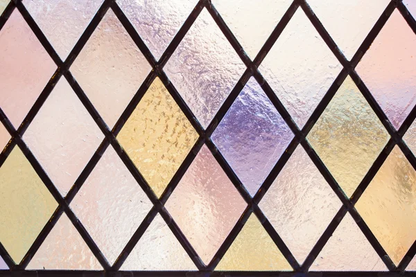 Stained glass with multi colored diamond pattern as background — Stock Photo, Image