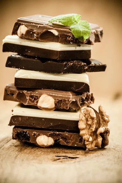 Stack of different sorts chocolate and walnut — Stock Photo, Image