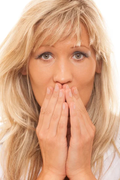 Woman covering her mouth with hands — Stock Photo, Image