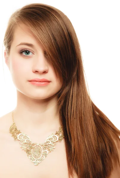 Portrait of girl with bang covering eye in golden necklace — Stock Photo, Image