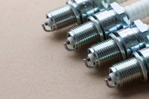 Auto service. Set of spark plugs as spare part of car. — Stock Photo, Image