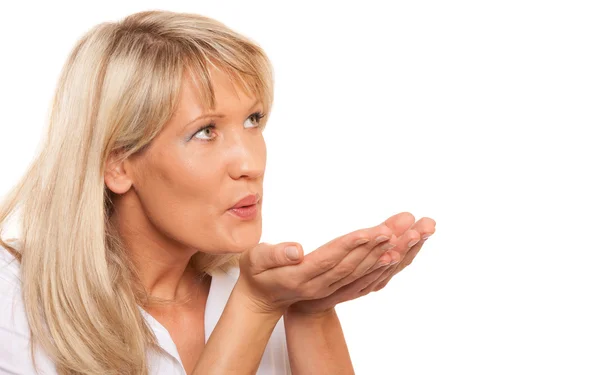 Portrait of mature woman blowing a kiss isolated — Stock Photo, Image