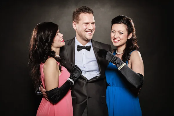 Love triangle. Two laughing women and man. Fun. — Stock Photo, Image