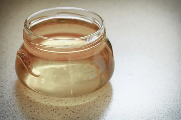 Jar of organic floral honey — Stock Photo, Image