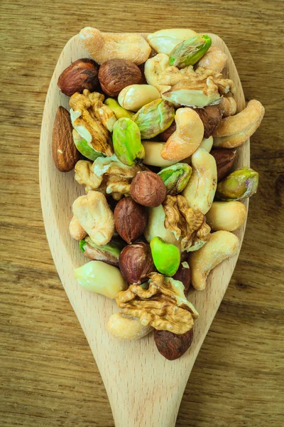 Mix of nuts on spoon — Stock Photo, Image