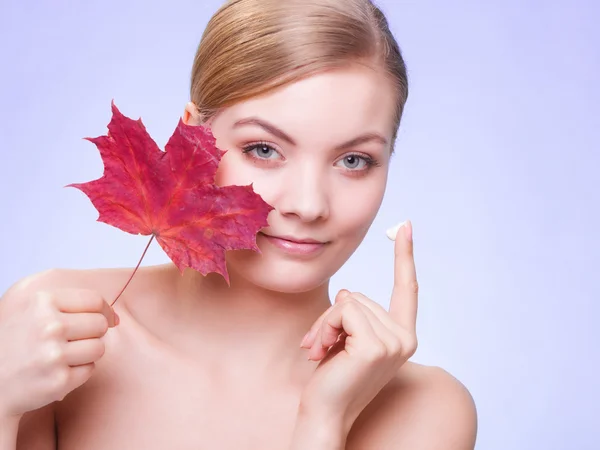 Woman with red maple leaf. — Stock Photo, Image