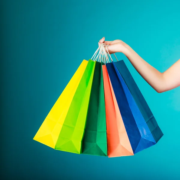 Shopping bags in female hand — Stock Photo, Image