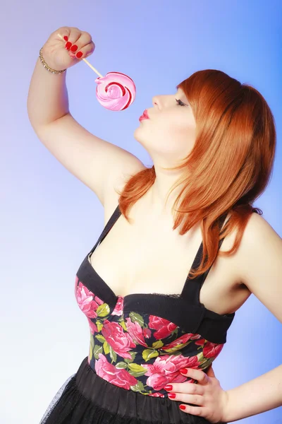 Redhair girl holding lollipop candy — Stock Photo, Image