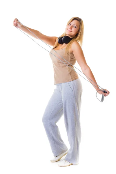 Fitness girl doing exercise with jump rope — Stock Photo, Image