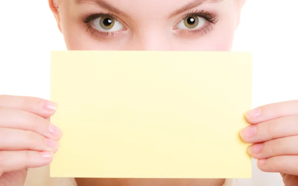 Businesswoman covering face with blank card — Stock Photo, Image