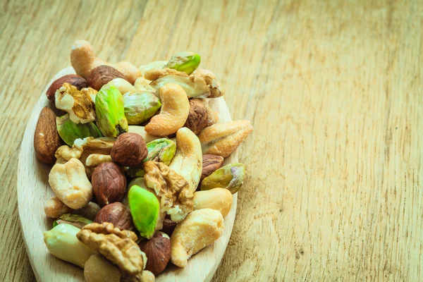 Mix of nuts on spoon — Stock Photo, Image