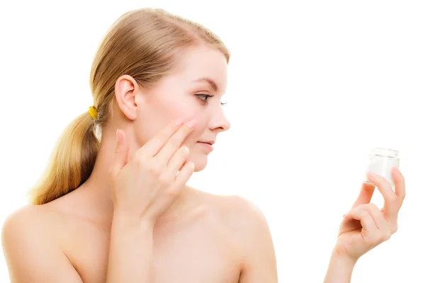 Girl applying moisturizing cream — Stock Photo, Image