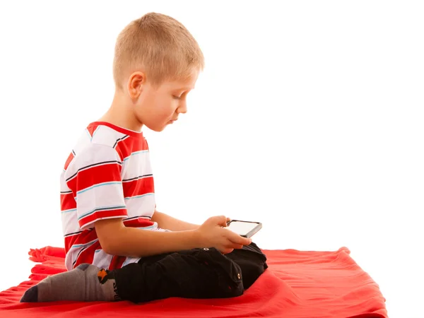 Boy playing games on smartphone — Stock Photo, Image