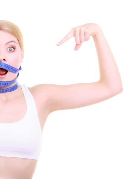 Woman with measure tape around head — Stock Photo, Image