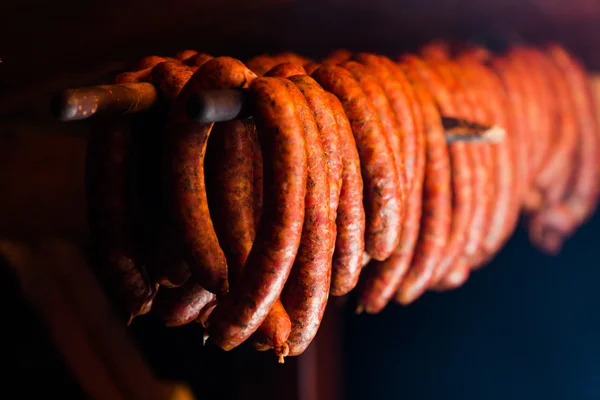 Smoked sausages in smokehouse — Stock Photo, Image