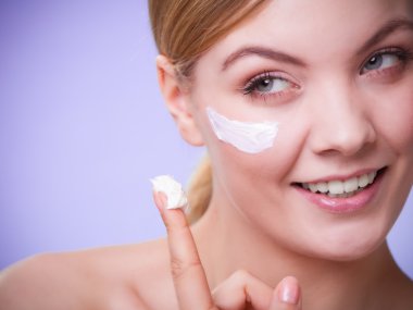 Woman taking care of dry skin clipart