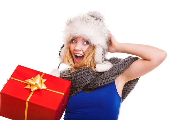 Girl in fur hat with gift box — Stock Photo, Image