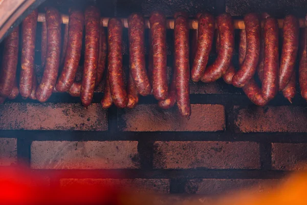 Smoked sausages in smokehouse — Stock Photo, Image