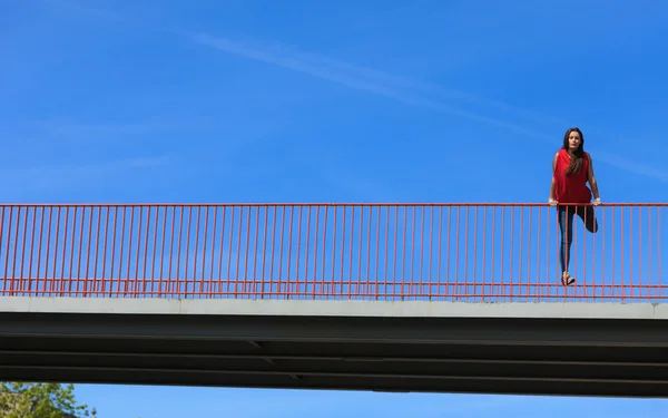 Teenage girl on urban bridge — Stock Photo, Image