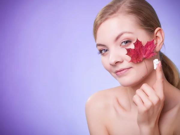 Woman with red maple leaf — Stock Photo, Image