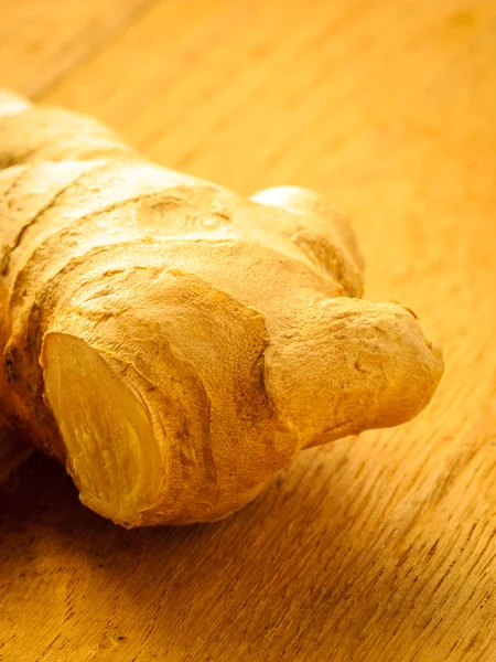 Fresh ginger on wooden table — Stock Photo, Image