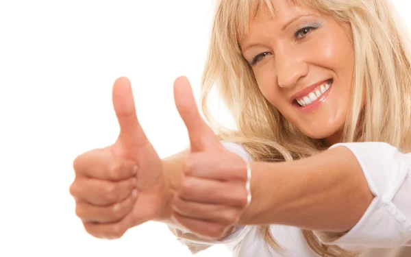 Mature woman giving thumbs up — Stock Photo, Image