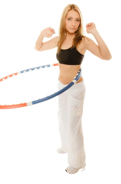 Girl doing exercise with hula hoop — Stock Photo, Image