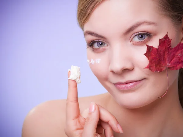 Woman with red maple leaf — Stock Photo, Image