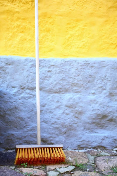 Large broom on wall outdoor — Stok fotoğraf