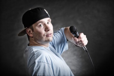 Rap singer holding microphone clipart